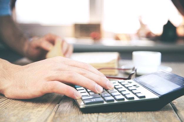 Man using calculator