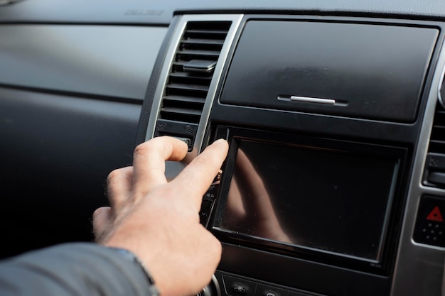 man using car audio stereo system