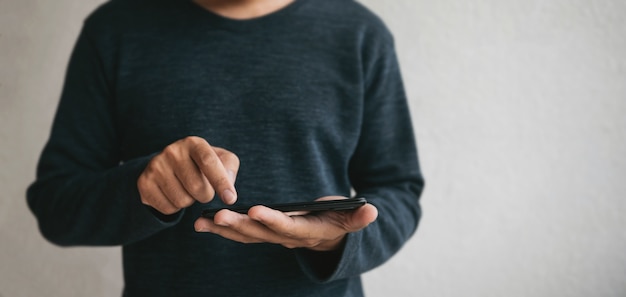 man using cellphone for searching data and social media on internet