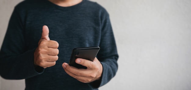 man using cellphone for searching data and social media on internet