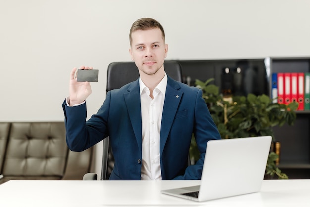 Man using credit card for payments in the office