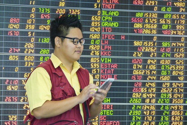 Photo man using digital tablet by stock market data