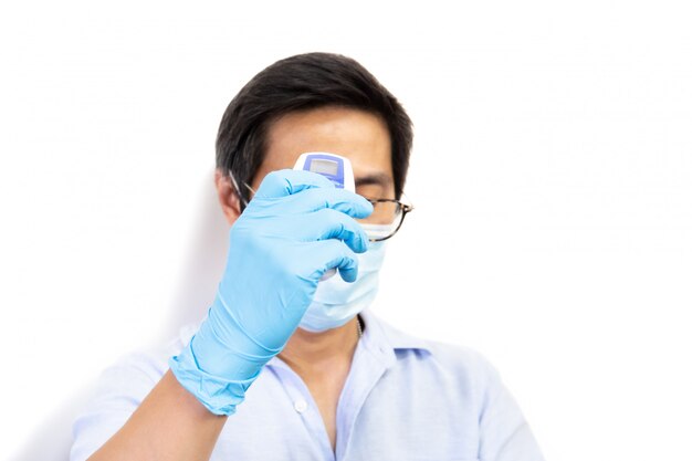 Man using digital thermometer to measures coronavirus symptoms isolated.
