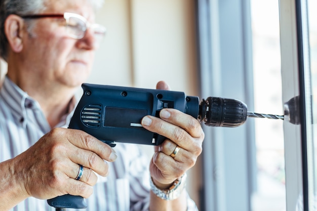 Man using drilling machine