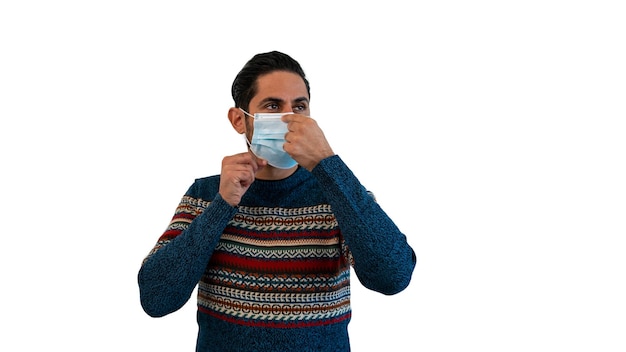 Man using face mask to safe from coronavirus isolated on white background. Concept of Covid-19 pandemic quarantine