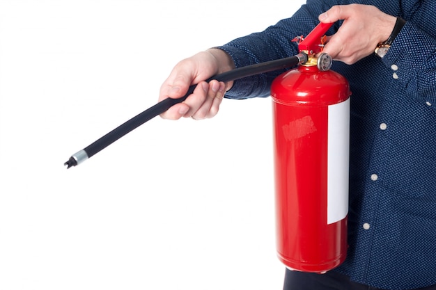 Man using fire extinguisher isolated on white