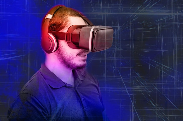 Man using glasses of virtual reality on dark background