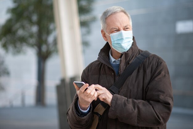 Man using her mobile phone outdoor