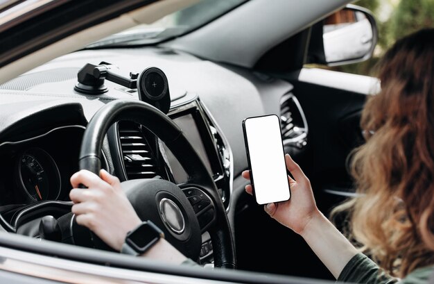 Man using iphone in car