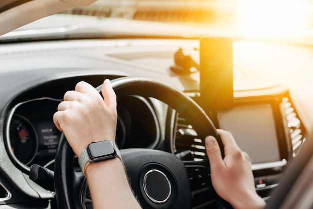 Man using iphone in car