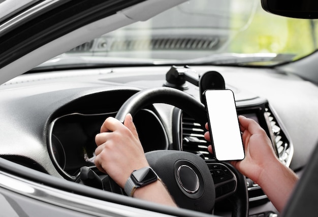 Man using iphone in car