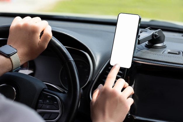 Man using iphone in car