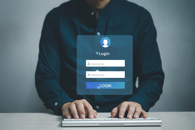 オンラインの仮想デジタルアカウントで、タッチスクリーンのユーザー名とパスワード入力でキーボードコンピューターのログインインターフェイスを使用している男性