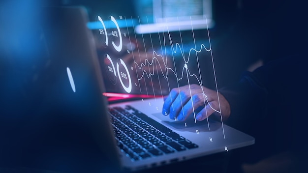 man using laptop in the dark