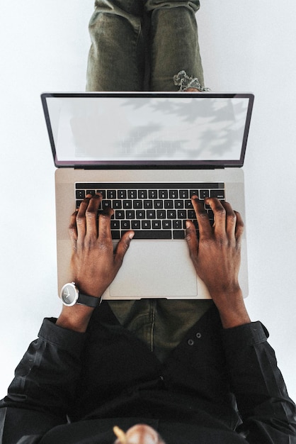 Man using a laptop device