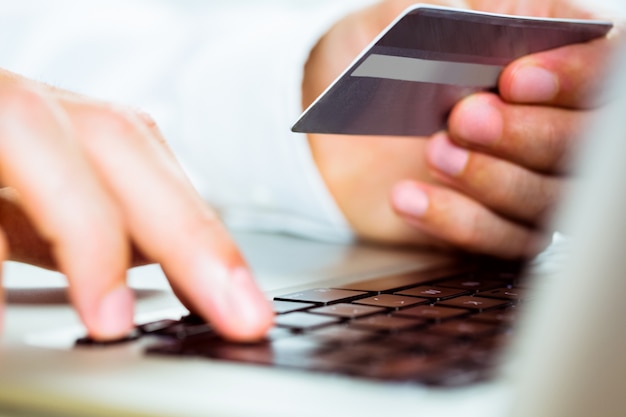 Man using laptop for online shopping