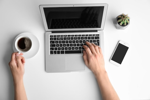 Man using laptop on table top view