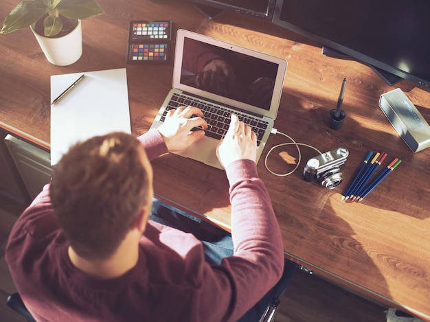 Man using laptop at table