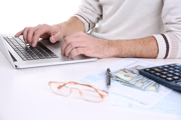 Man using laptop at the table