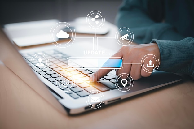 man using laptop with update software computer program upgrade business technology internet update on virtual screen internet and technology concept loading bar with installing the update