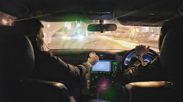 Man using mobile phone in car