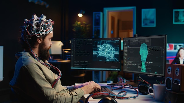 Man using neuroscientific device to transfer consciousness typing code