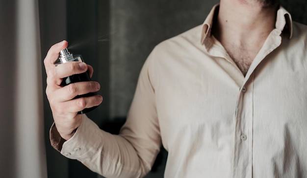 Man using perfume