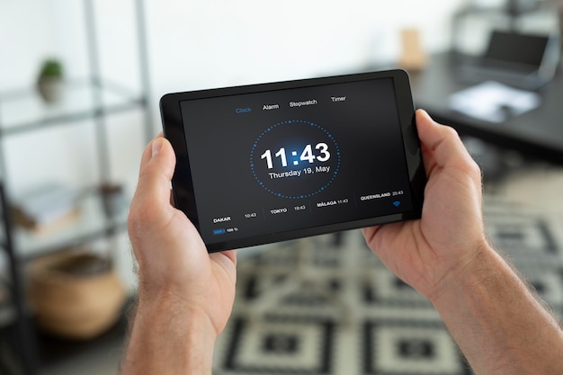 Photo man using a smart home tablet indoors