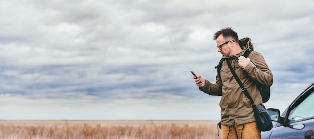 Man using smart phone outdoor