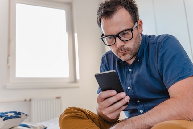 Man using smart phone