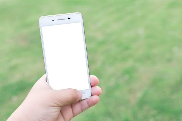 Man using smartphone blurred images in Abstract inside green bokeh background with circles