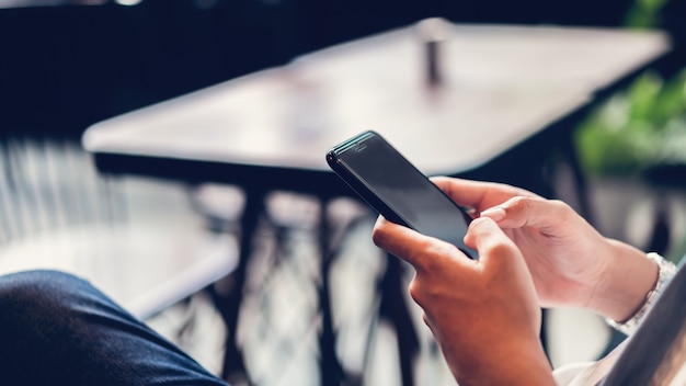 Man using smartphone, during leisure time. the concept of using the phone is essential in everyday life.