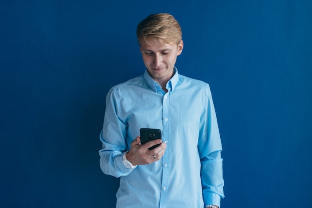 Man using smartphone he holding mobile smart phone, using app.