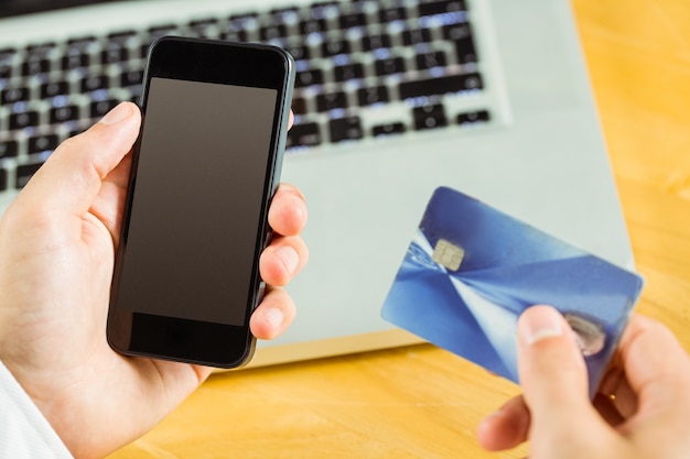 Man using smartphone for online shopping