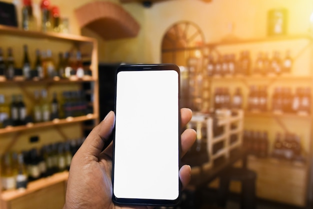 A man using a smartphone with blank screen