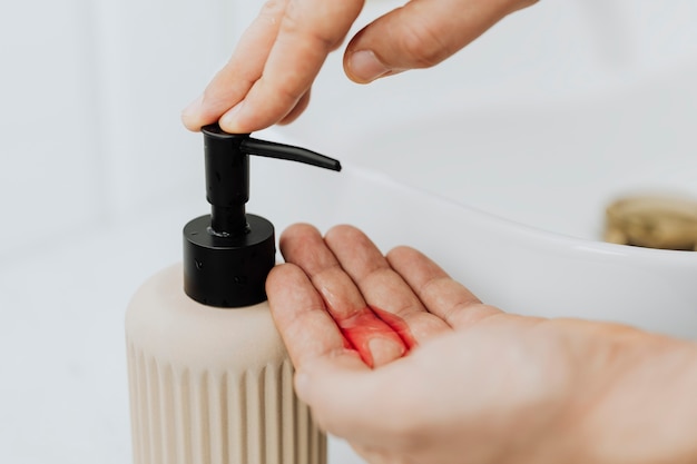 Man using a soap dispenser