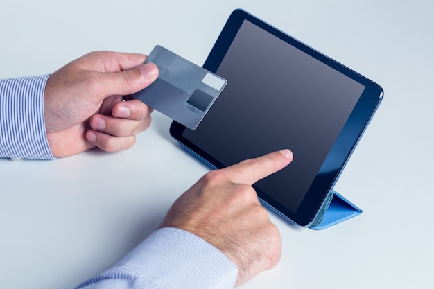 Man using tablet for online shopping