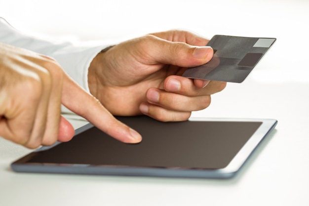 Man using tablet for online shopping