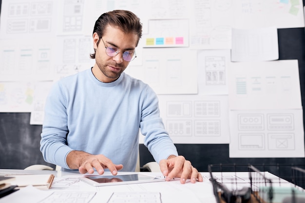 Man Using Tablet PC In Office