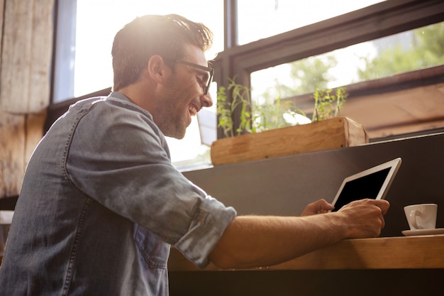 Man using a tablet sitting