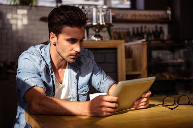 Man using a tablet sitting