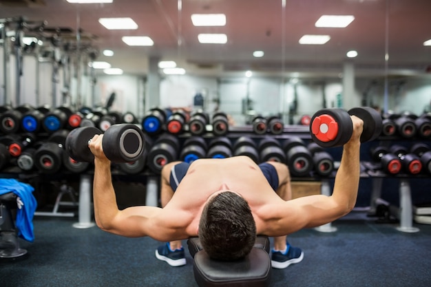 Man using weights in his workout