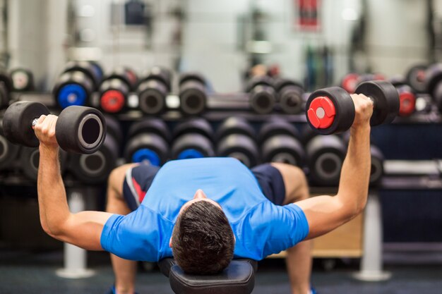 Man using weights in his workout