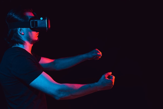 A man in virtual reality glasses is in a simulation