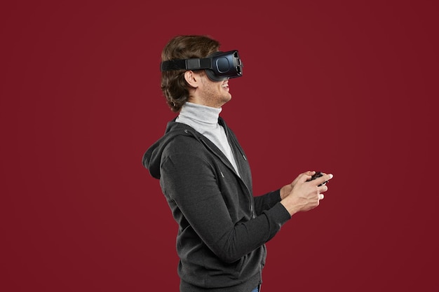 Man in VR goggles playing videogame