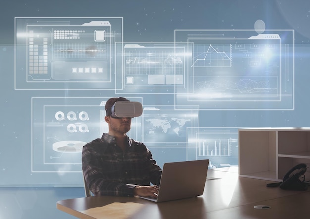 Man in VR headset using the computer against blue background with interfaces