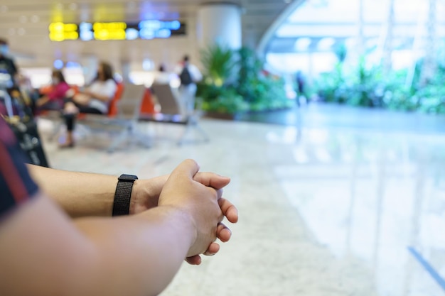 Man waiting for flight in airport departure area at airport waiting the flight