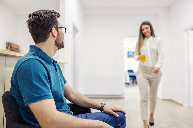 A man in a waiting room waits for technical inspection.