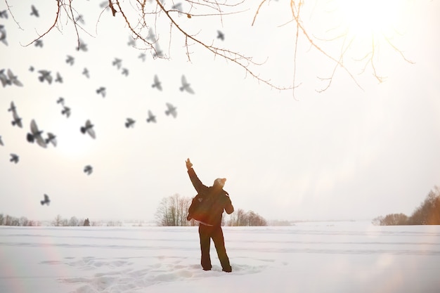 A man on a walk. Winter landscape. Tourist in the winter journey.