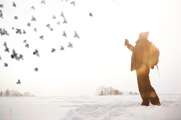 A man on a walk. Winter landscape. Tourist in the winter journey.